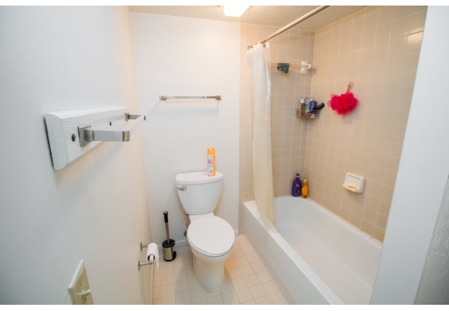 The bathing and toilet area offer privacy for those sharing the bathroom.