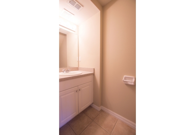 The half bathroom downstairs offers convenience to residents and their guests.